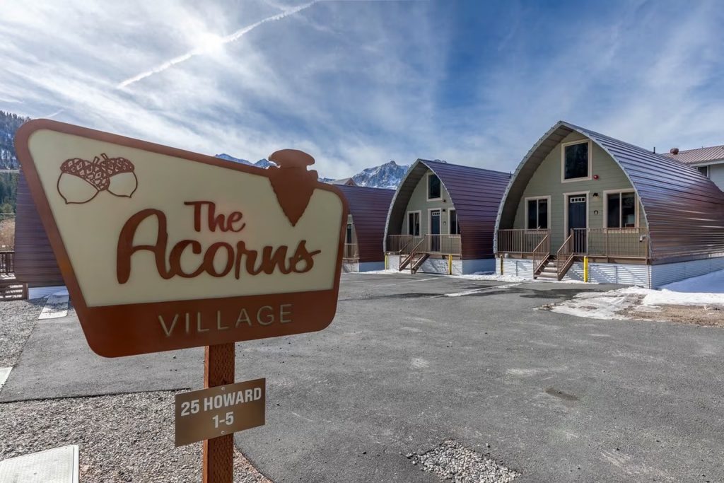 The Acorns Village entrance sign and detached cabins at 25 Howard Ave, June Lake CA